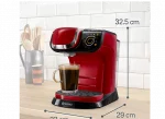 Machine à café Tassimo sur un plan de travail de cuisine, avec des dimensions visibles pour la hauteur, la largeur et la profondeur, sur un fond de cuisine flouté